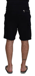Shorts bermuda en coton noir de Dolce & Gabbana, style cargo, avec poches latérales et finition élégante.