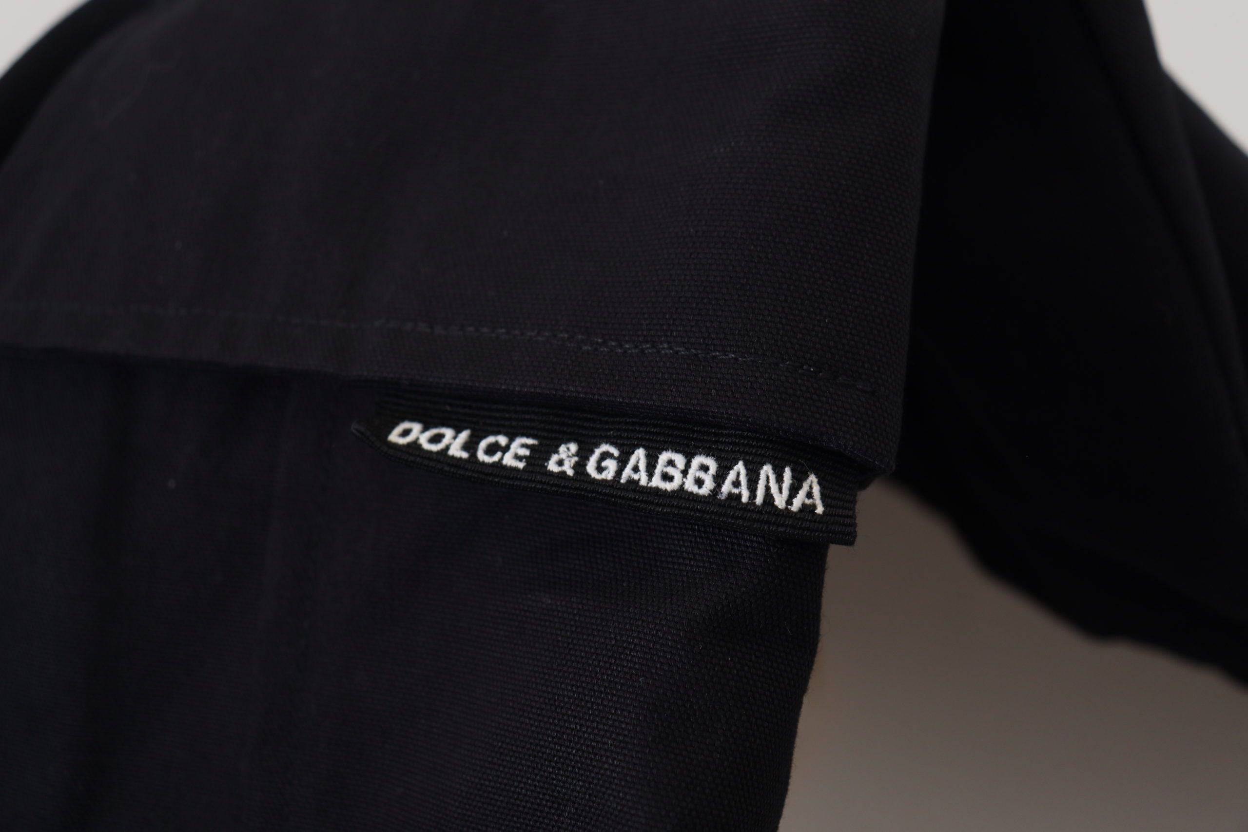 Shorts bermuda en coton noir de la marque Dolce & Gabbana, style cargo avec poches pratiques et design élégant.