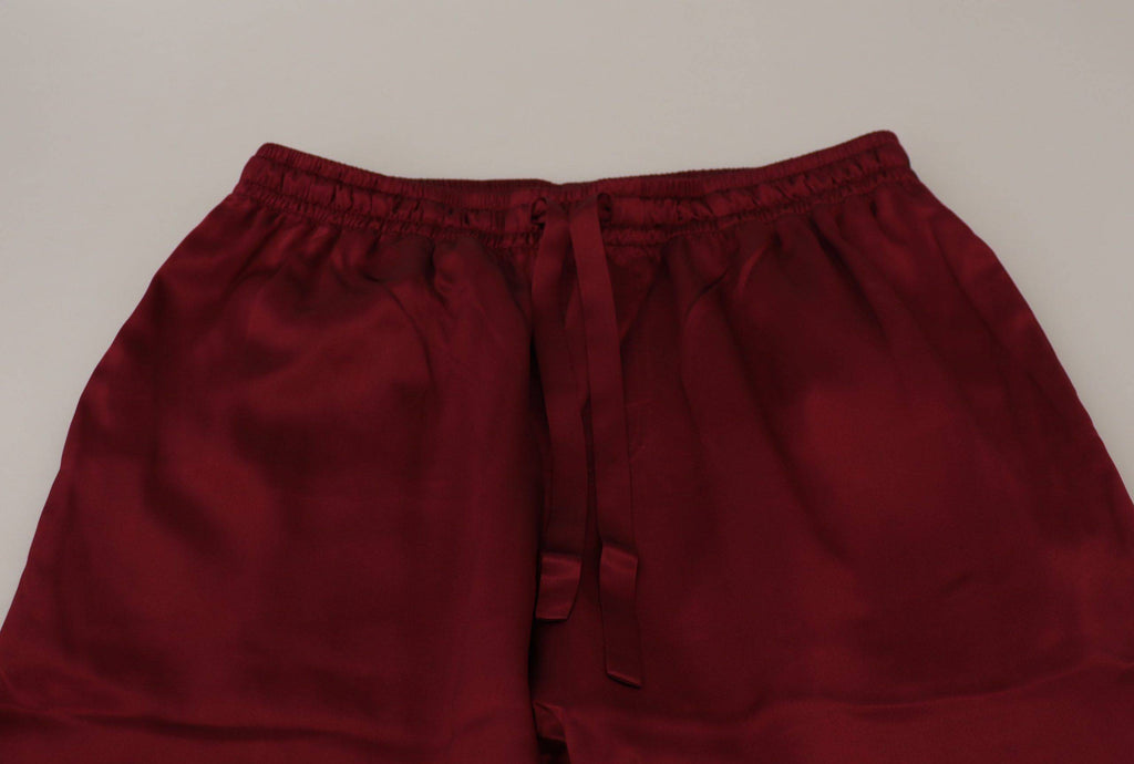 Pantalons de détente en soie Bordeaux Dolce & Gabbana avec logo DG, confort et élégance pour la maison.