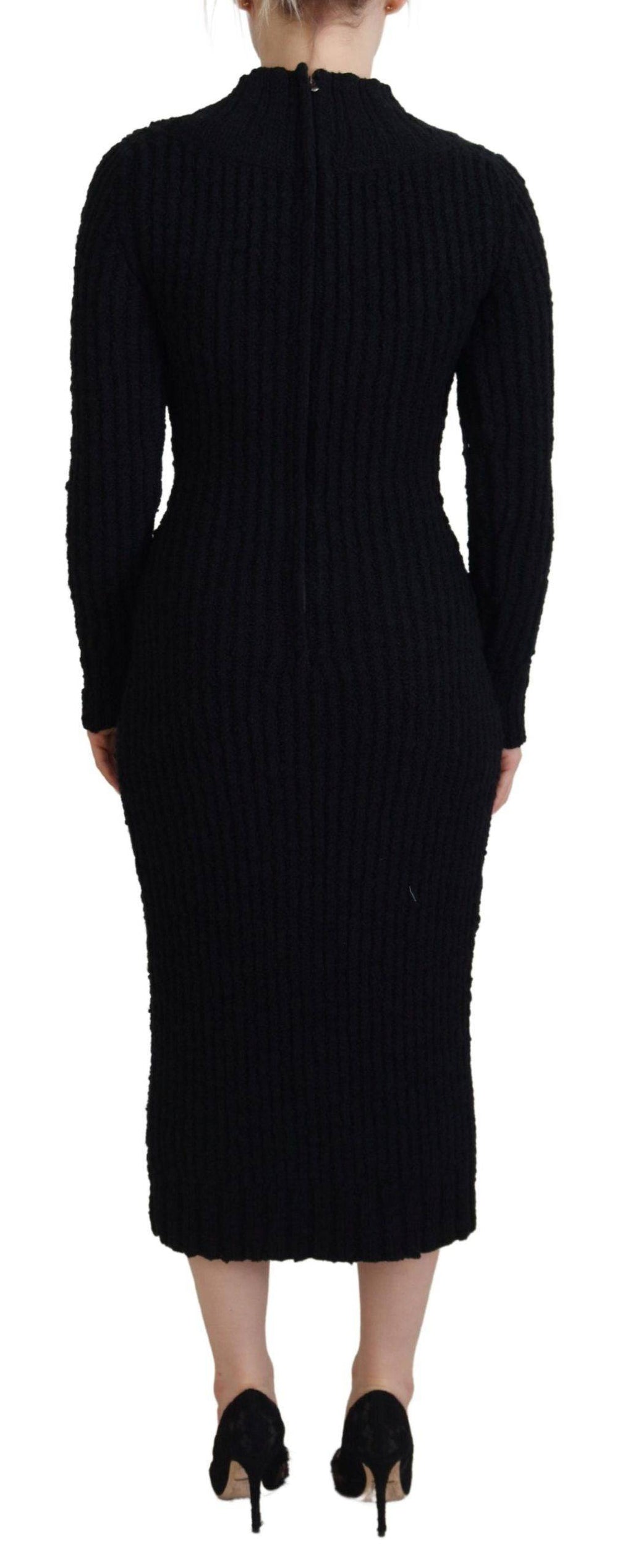 Robe pull en laine noire de Dolce & Gabbana, coupe ajustée et manches longues, élégante et confortable.