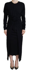 Robe longue midi noire Dolce & Gabbana en laine avec ceinture enveloppante, silhouette élégante et sophistiquée.
