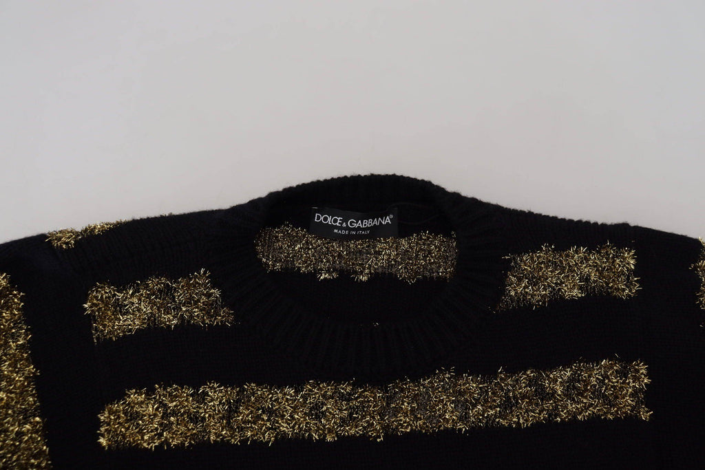 Pull en cachemire noir et or Dolce & Gabbana avec cristaux, élégant et luxueux, visible en détail dans cette image.