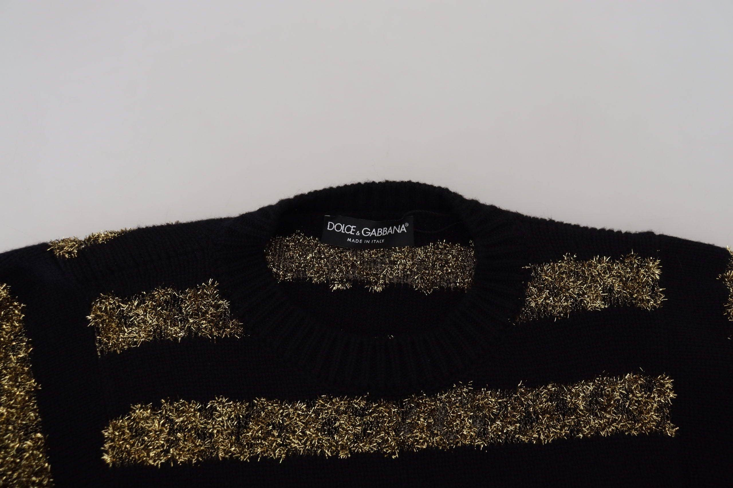Pull en cachemire noir et or Dolce & Gabbana avec cristaux, élégant et luxueux, visible en détail dans cette image.