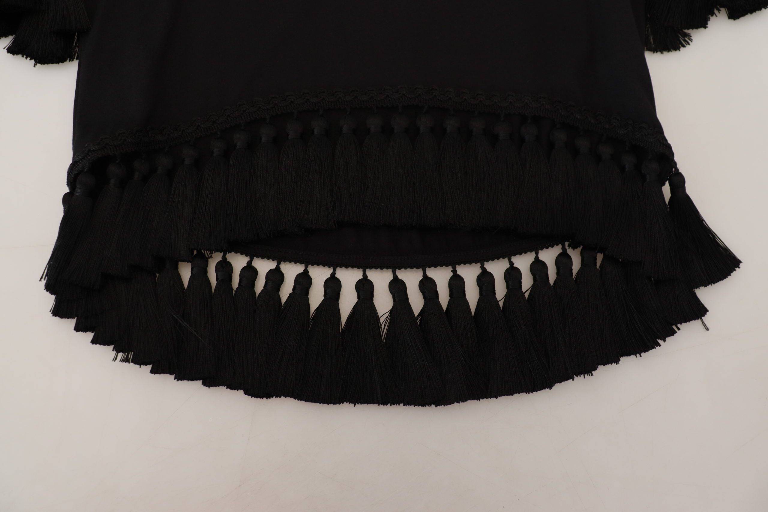 T-shirt blouse noire Dolce & Gabbana en coton avec franges, détails élégants et style sophistiqué visible sur l'image.