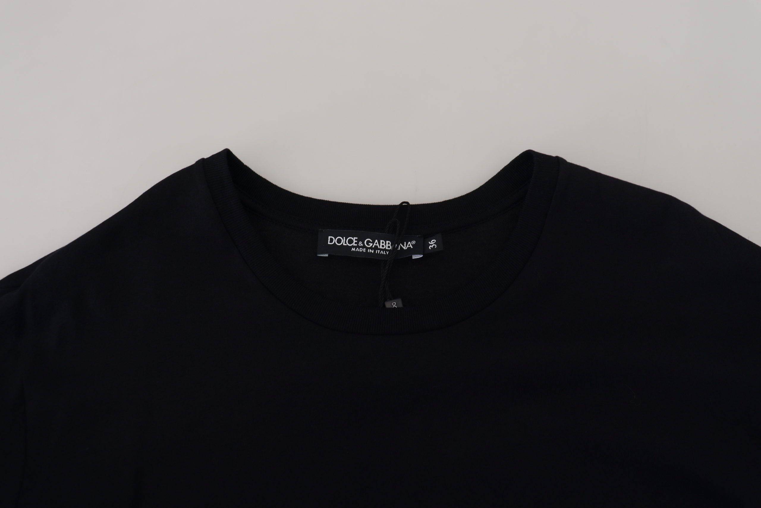 T-shirt blouse noire Dolce & Gabbana en coton avec franges, style décontracté et élégant, visible en détail.
