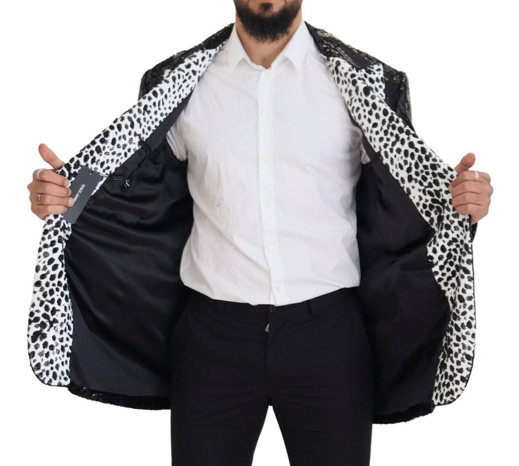 Blazer en nylon noir Dolce & Gabbana avec motif vache pailleté et sequins, style élégant et tendance.