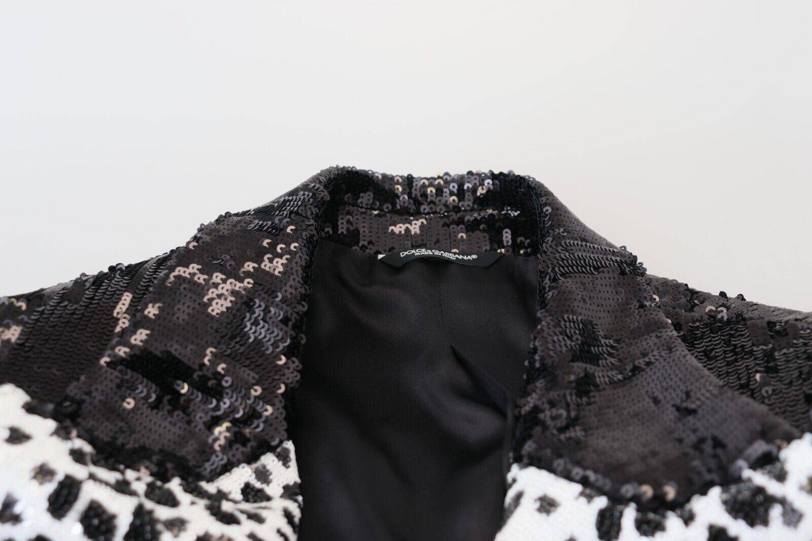 Blazer noir Dolce & Gabbana en nylon avec motif vache à sequins noirs, style élégant et tendance.