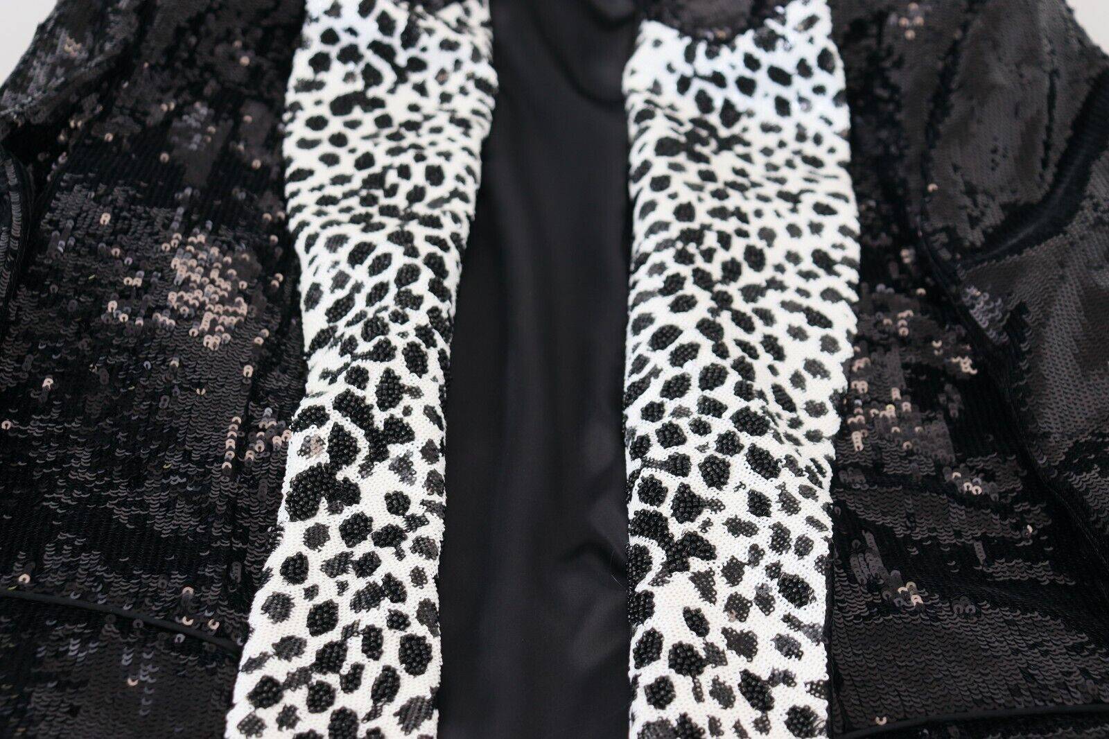 Veste en nylon noire Dolce & Gabbana avec motifs vache à sequins, blazer élégant et tendance.