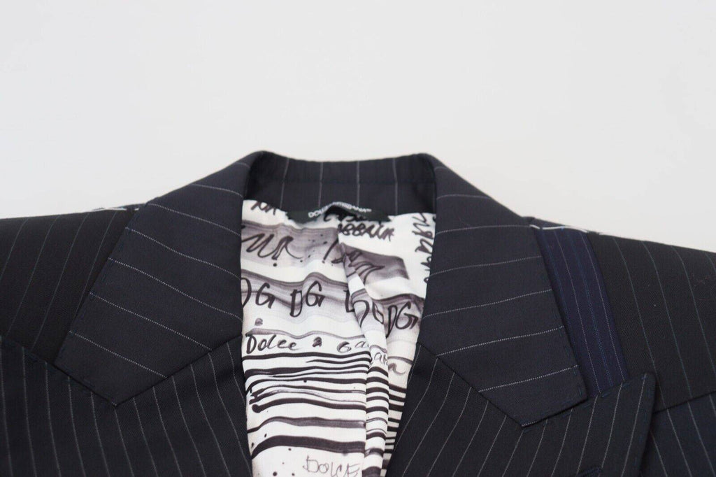 Blazer double boutonnage en laine bleue à patchwork de Dolce & Gabbana, coupe élégante et détails sophistiqués.