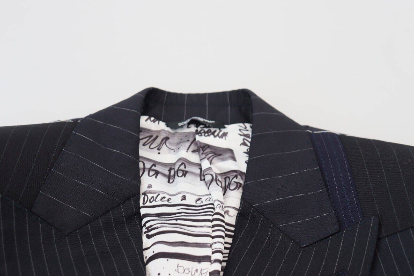 Blazer double boutonnage en laine bleue à patchwork de Dolce & Gabbana, coupe élégante et détails sophistiqués.