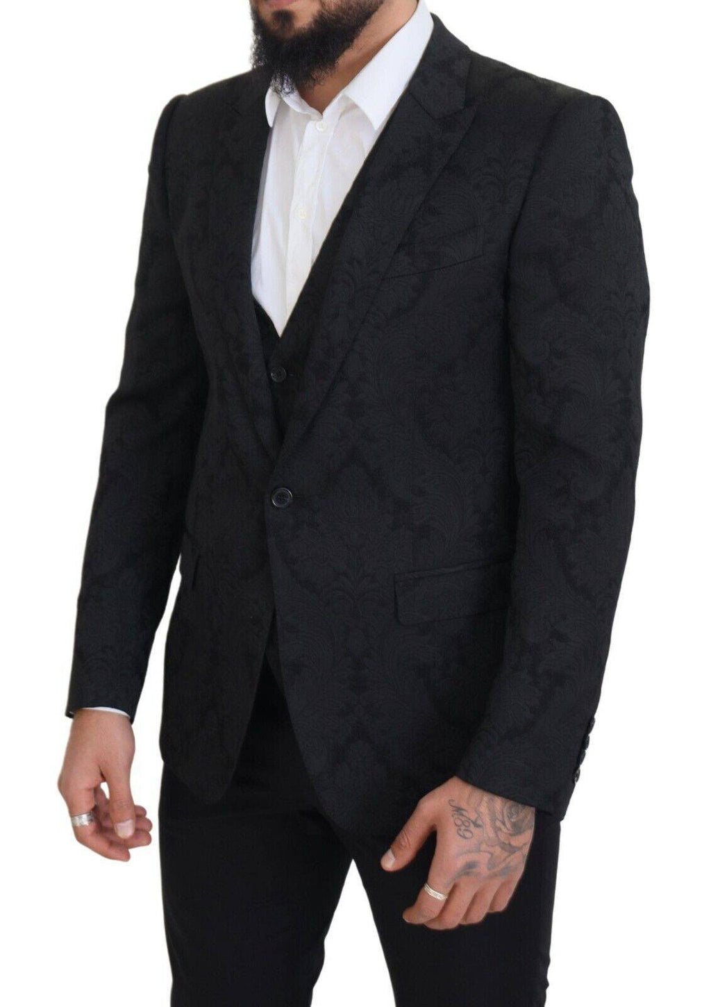 Costume deux pièces Dolce & Gabbana en brocart noir à fleurs, style martini, avec veste et pantalon élégants.