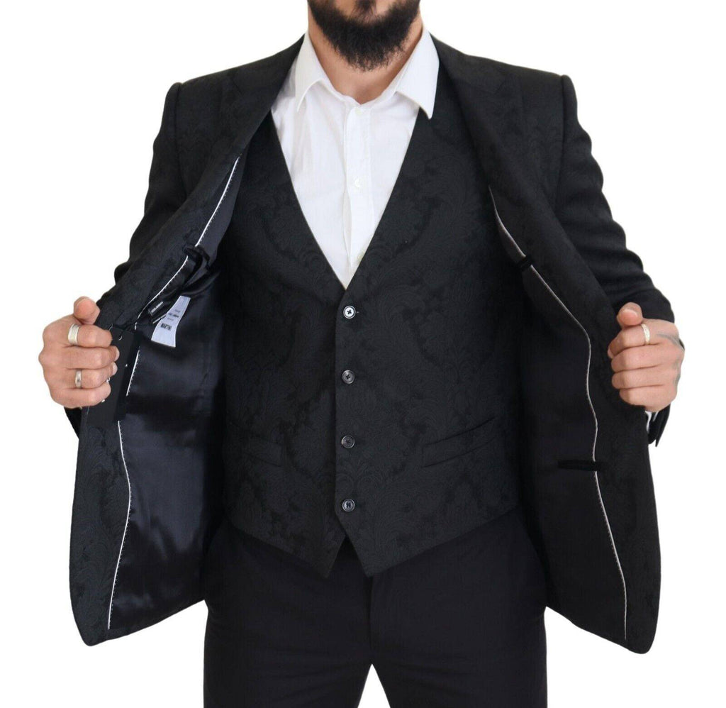 Costume deux pièces Dolce & Gabbana en brocart floral noir, style martini élégant et sophistiqué.