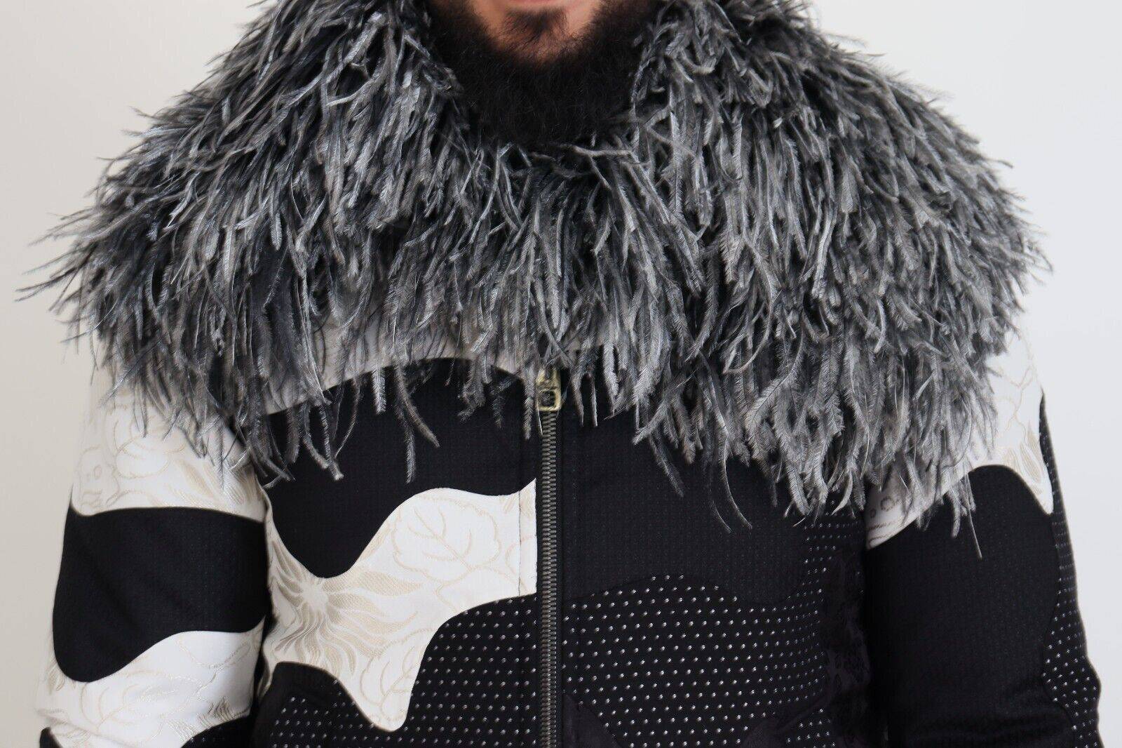 Veste en shearling noir et blanc Dolce & Gabbana avec fermeture éclair complète, look élégant et chaud.