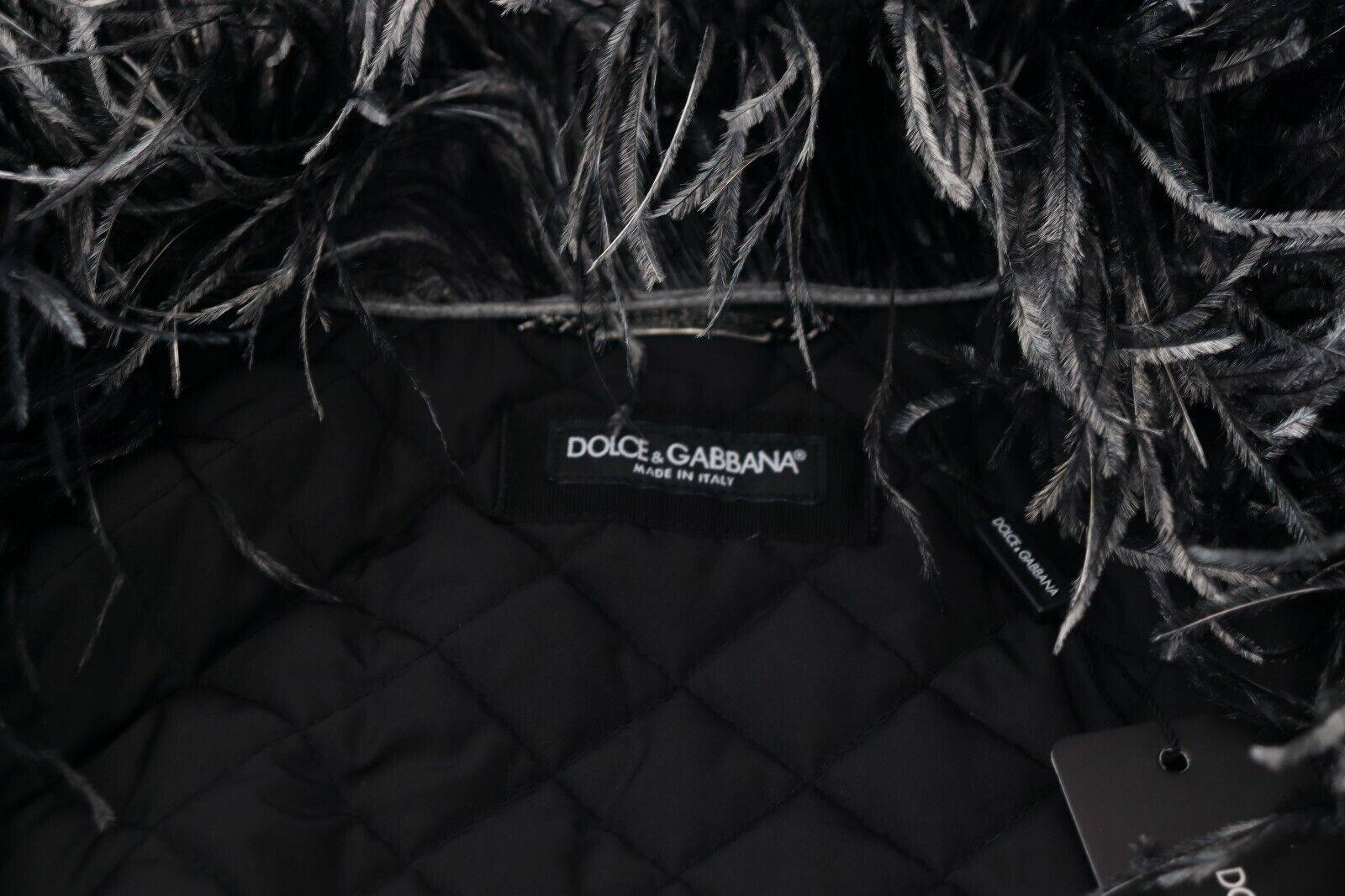 Veste en shearling noir et blanc Dolce & Gabbana avec fermeture éclair complète, doublure en fourrure, style chaud et élégant.