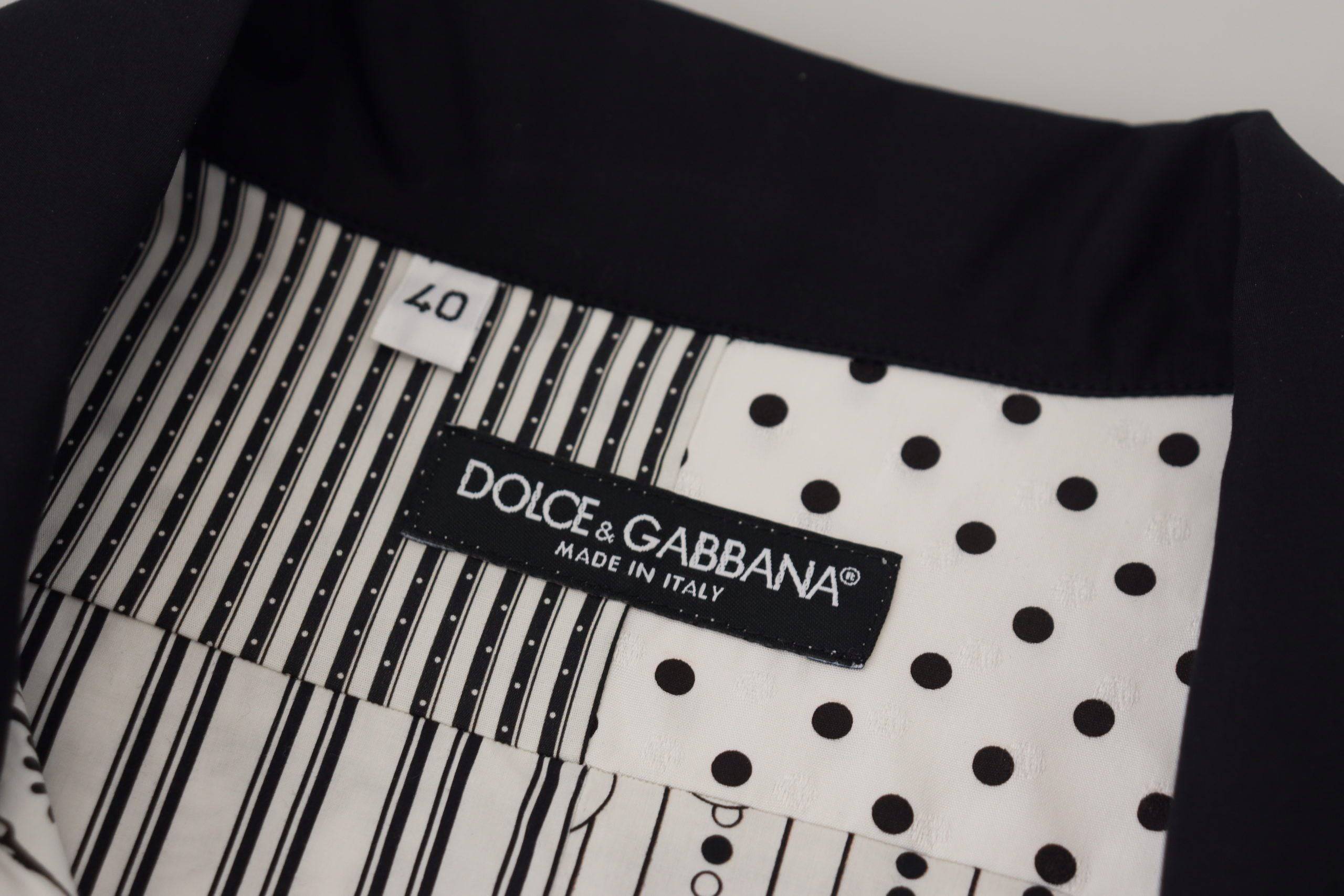 Chemise Dolce & Gabbana à motifs en blanc et noir avec boutons, vue détaillée du style élégant et sophistiqué.