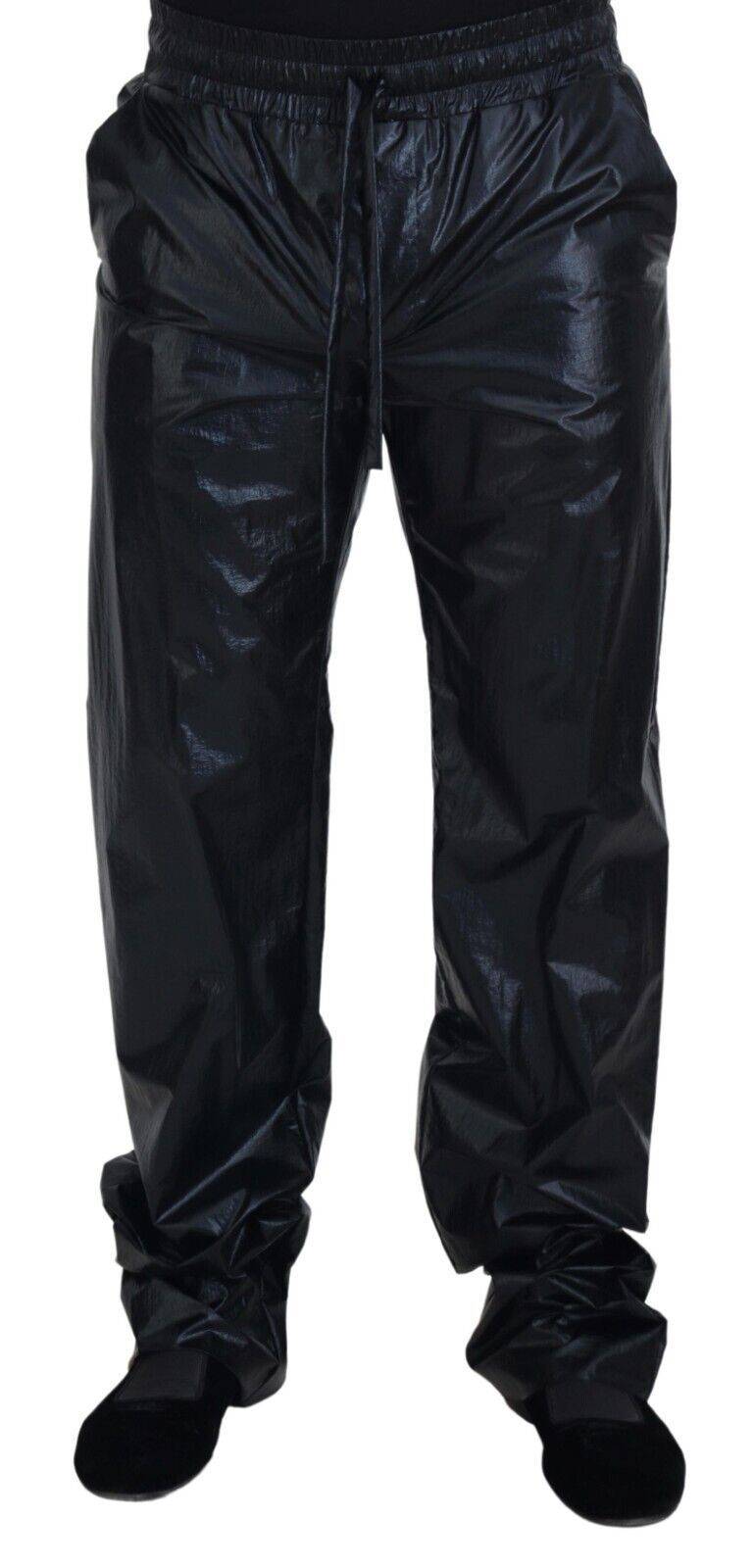 Pantalon noir en nylon brillant avec cordon de serrage de Dolce & Gabbana, style pantalon de sport élégant et moderne.