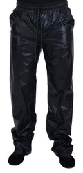 Pantalon noir en nylon brillant avec cordon de serrage de Dolce & Gabbana, style pantalon de sport élégant et moderne.