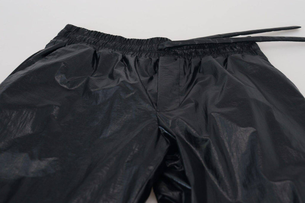 Pantalon en nylon noir de Dolce & Gabbana avec cordon de serrage brillant, style élégant et moderne.