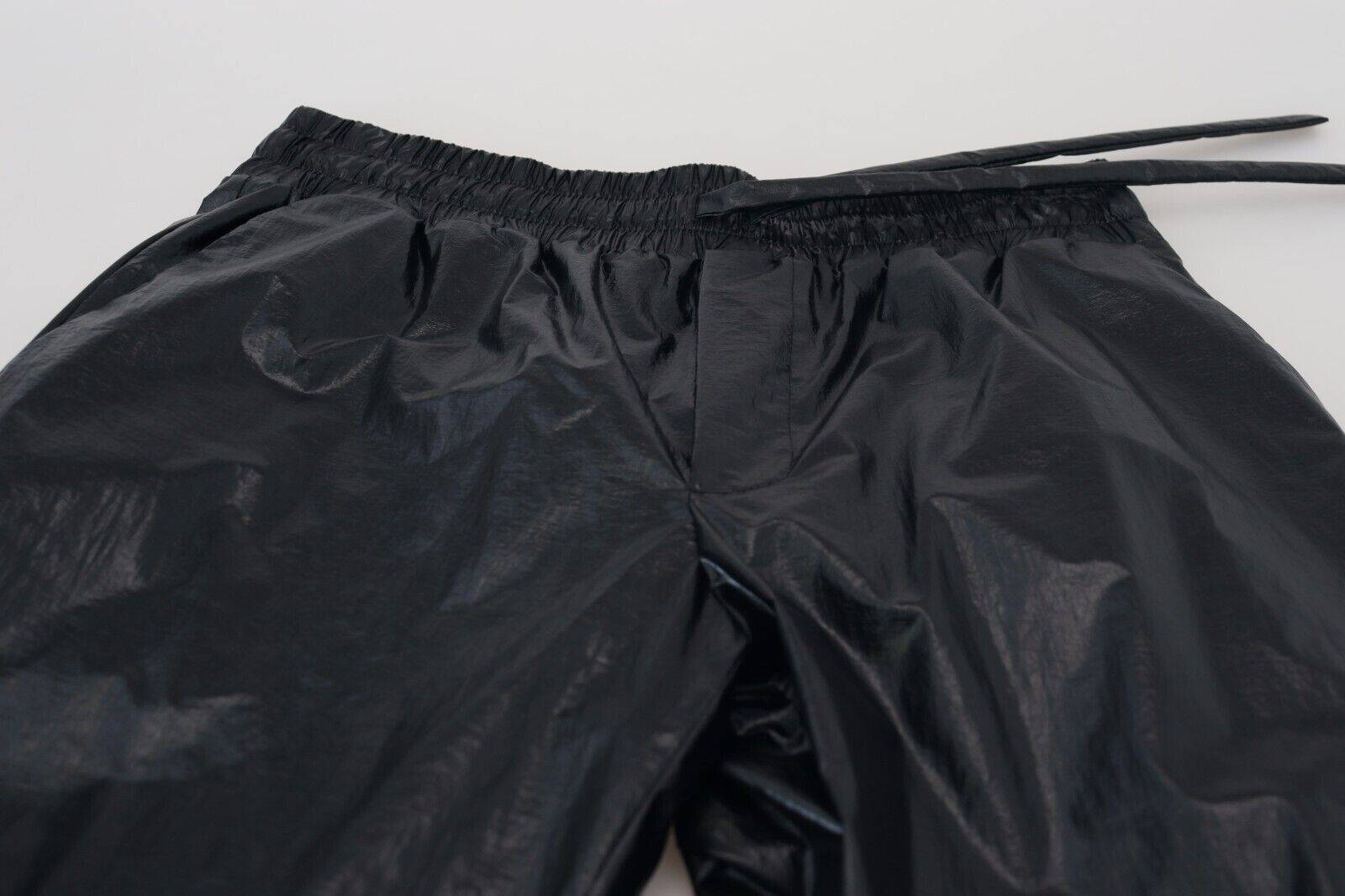Pantalon en nylon noir de Dolce & Gabbana avec cordon de serrage brillant, style élégant et moderne.