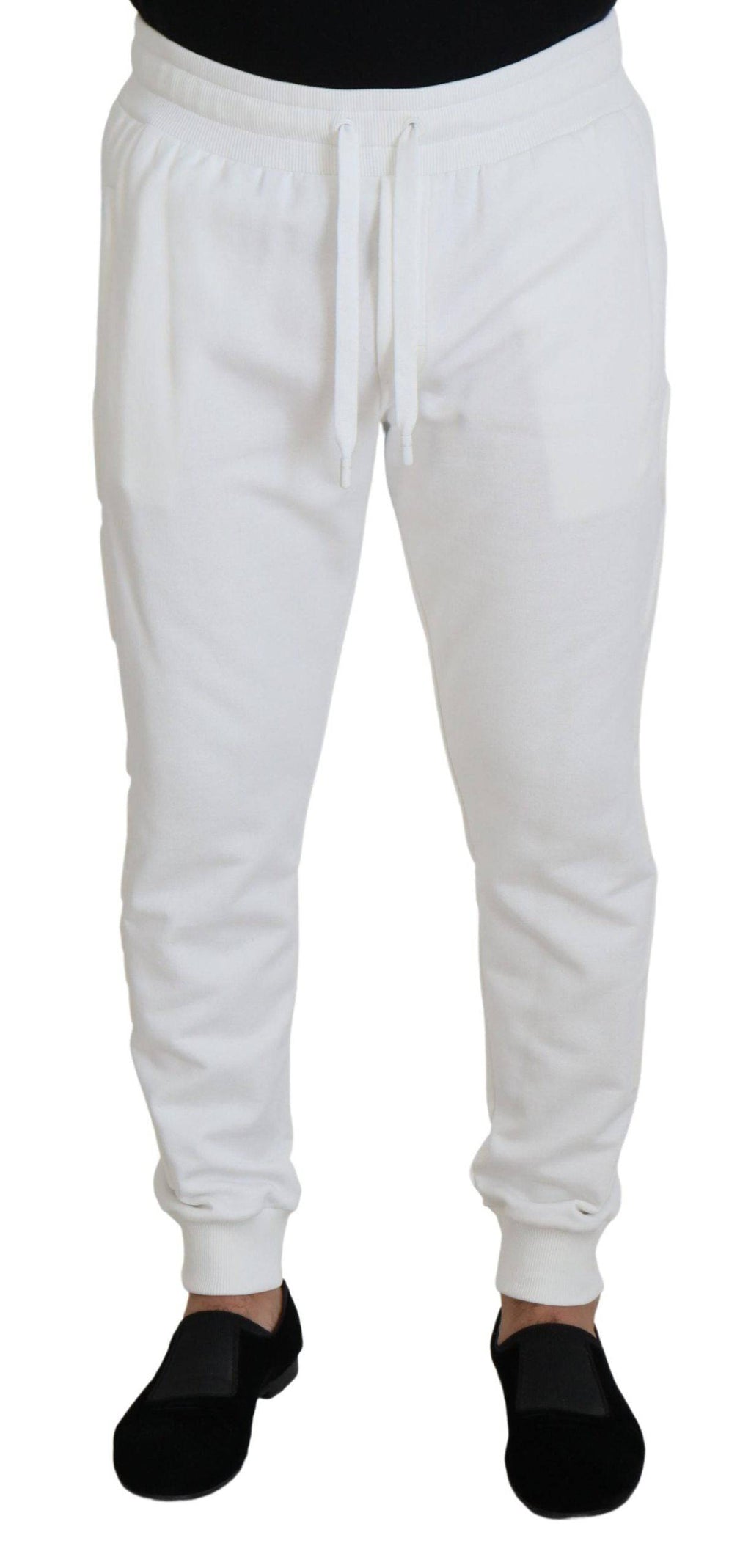 Pantalon de sport blanc Dolce & Gabbana en coton avec logo, style décontracté et confortable, visible en détail dans l'image.