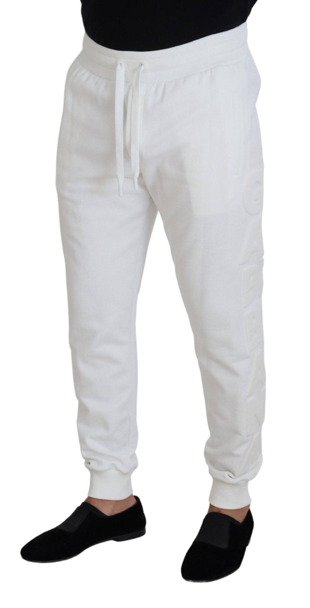 Pantalons de sport en coton blanc Dolce & Gabbana avec logo, coupe décontractée, idéal pour un style sportif et élégant.
