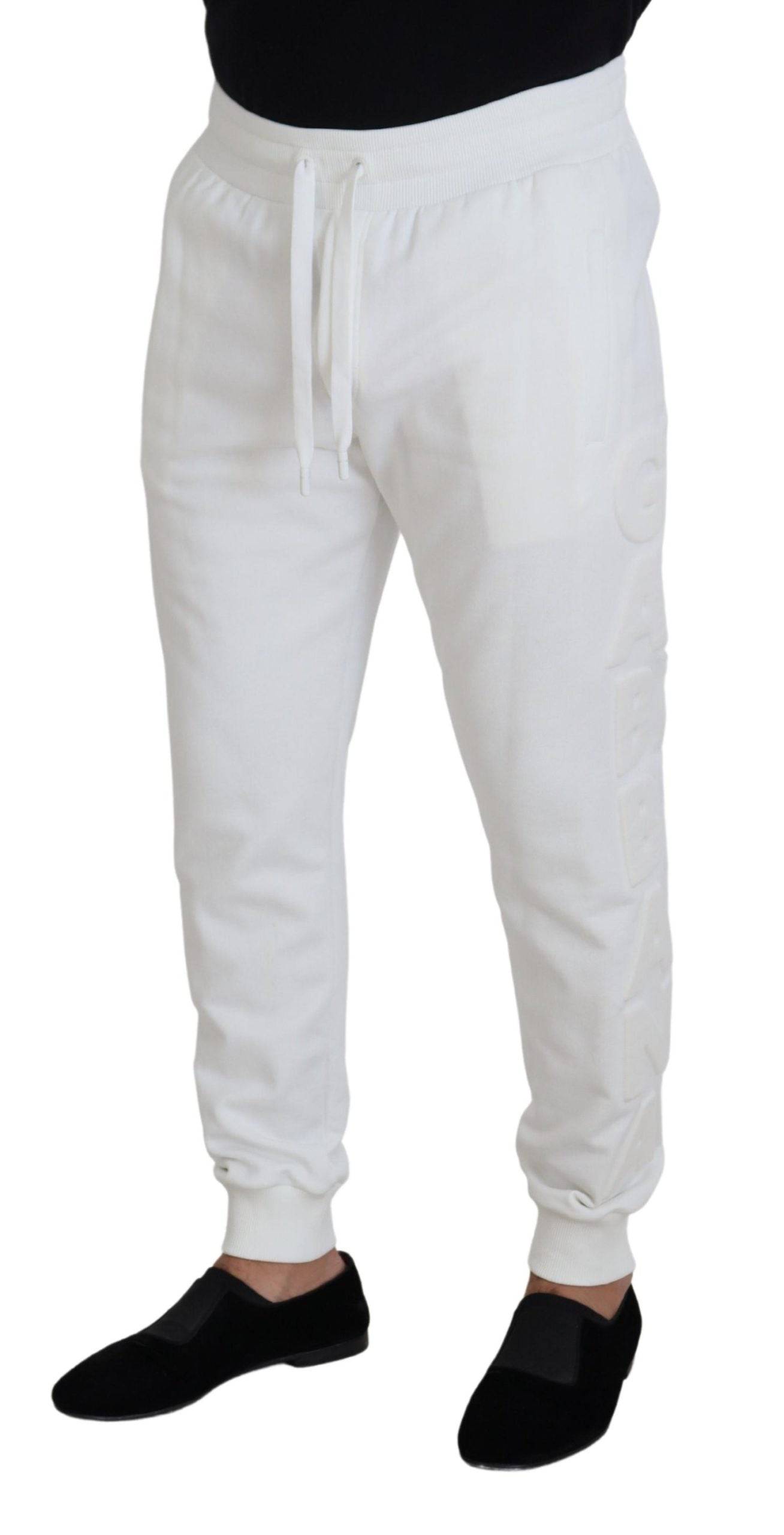 Pantalons de sport en coton blanc Dolce & Gabbana avec logo, coupe décontractée, idéal pour un style sportif et élégant.