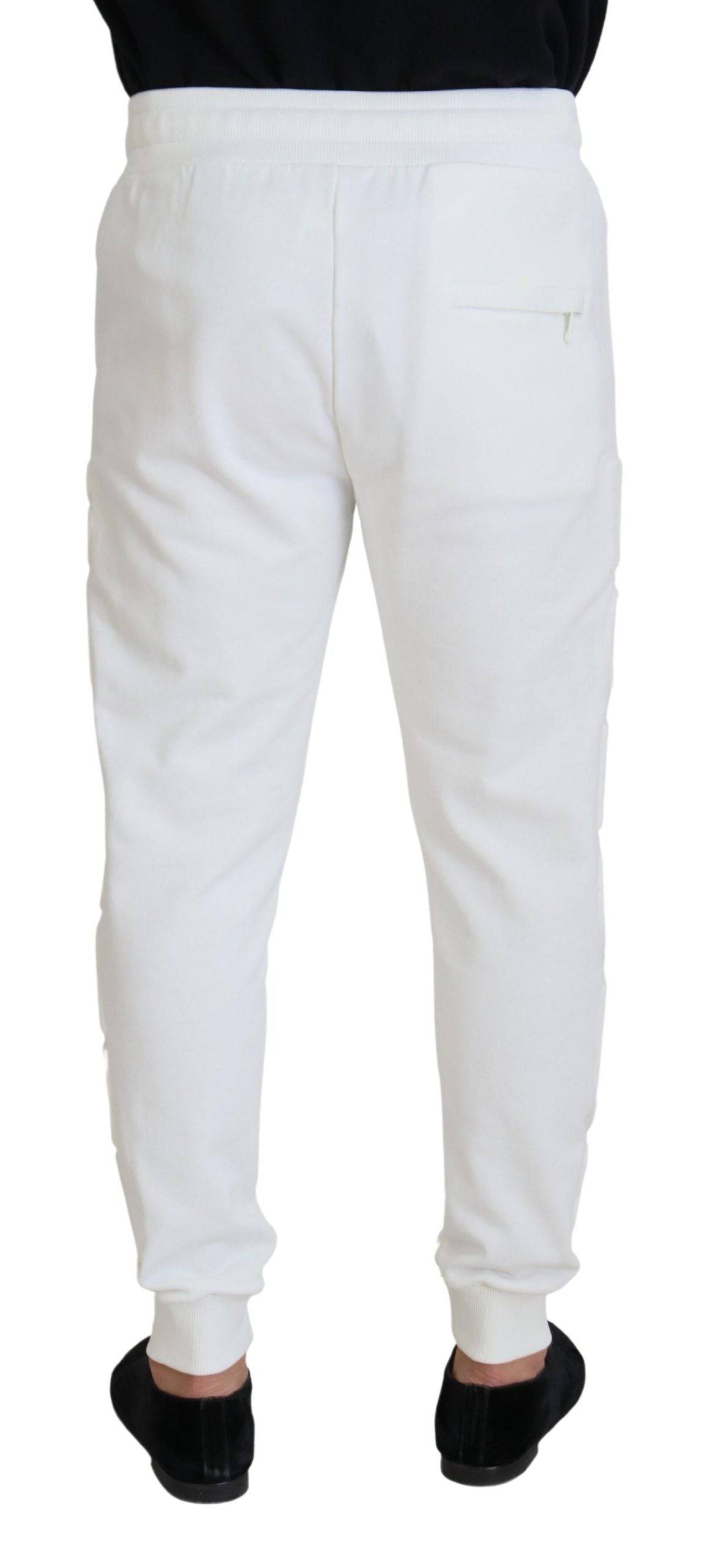 Pantalons de sport blancs Dolce & Gabbana en coton avec logo, style décontracté et confortable, vue de face.