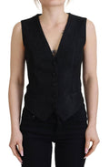 Veste sans manches Dolce & Gabbana en brocart noir avec boutons, élégante et sophistiquée.