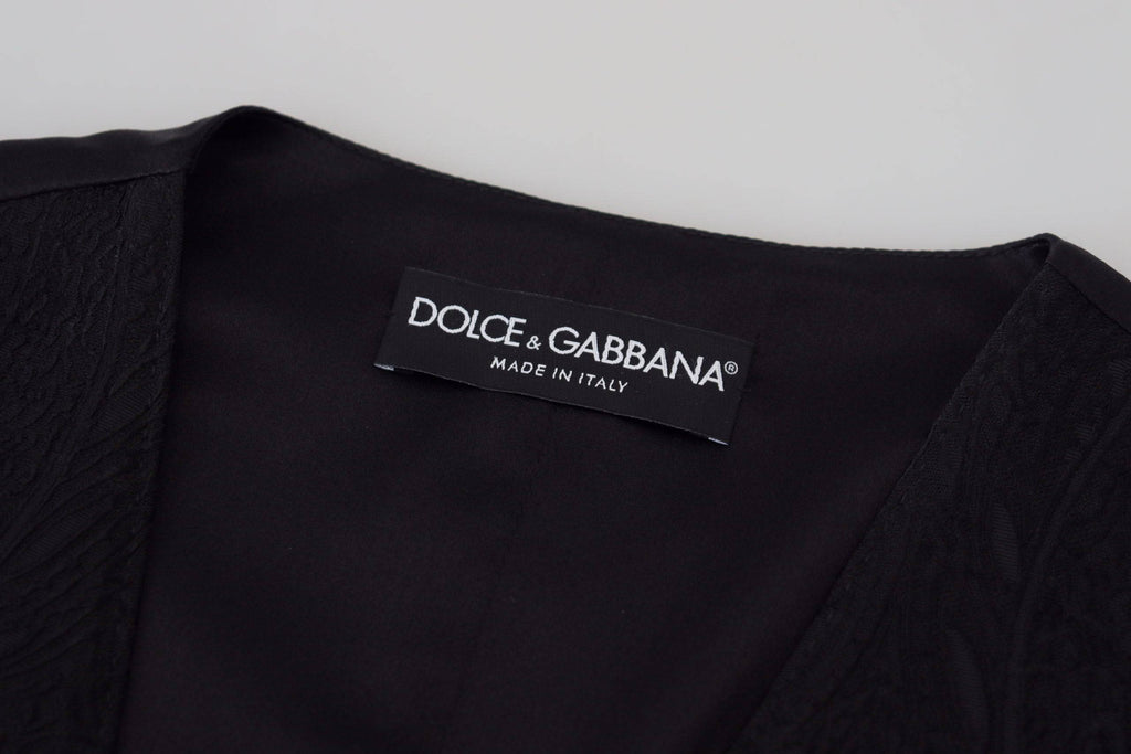 Top sans manches en brocart noir Dolce & Gabbana, veste avec boutons élégants et style sophistiqué.