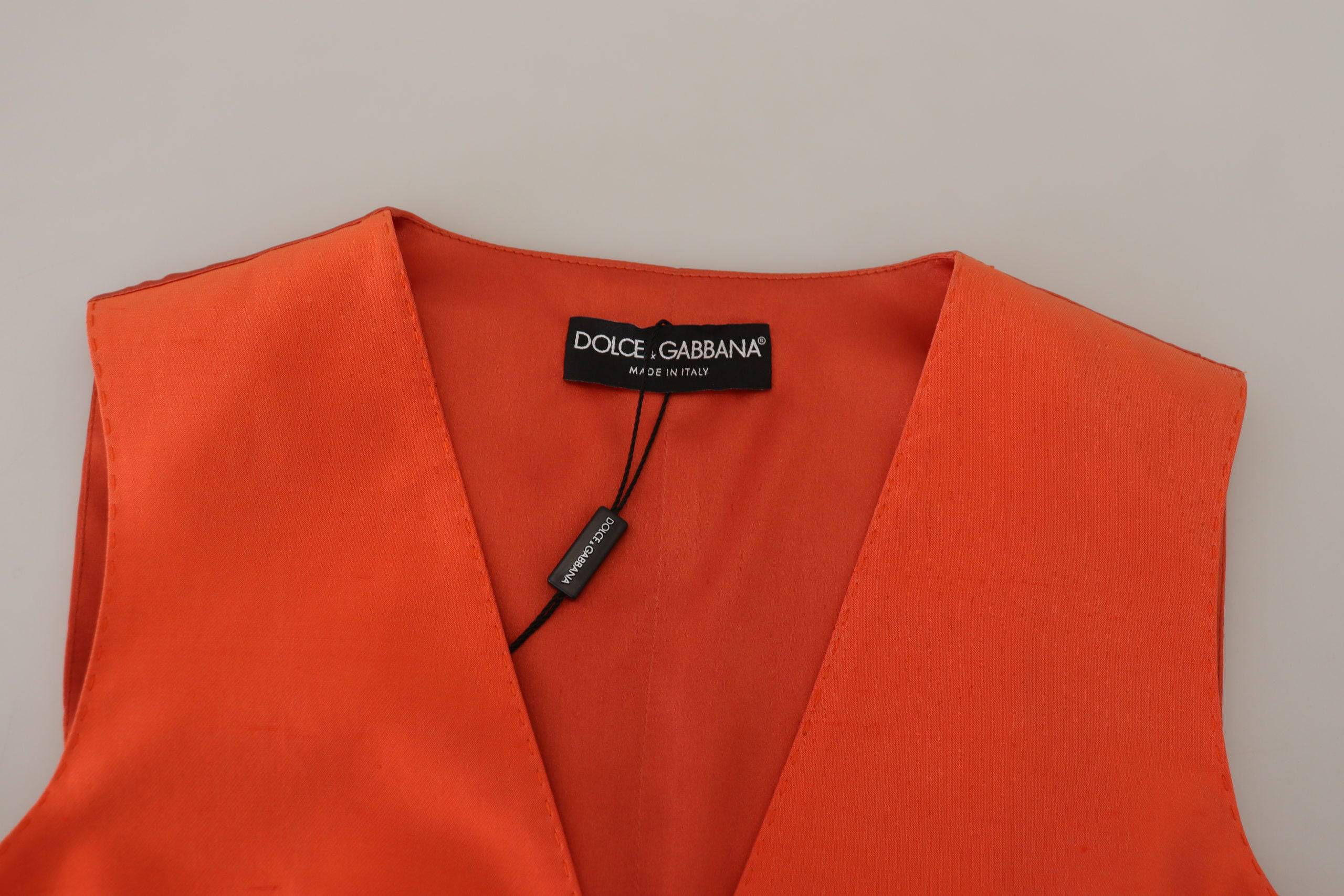 Gilet sans manches orange Dolce & Gabbana, coupe courte, veste cintrée, détail élégant, mode féminine sophistiquée
