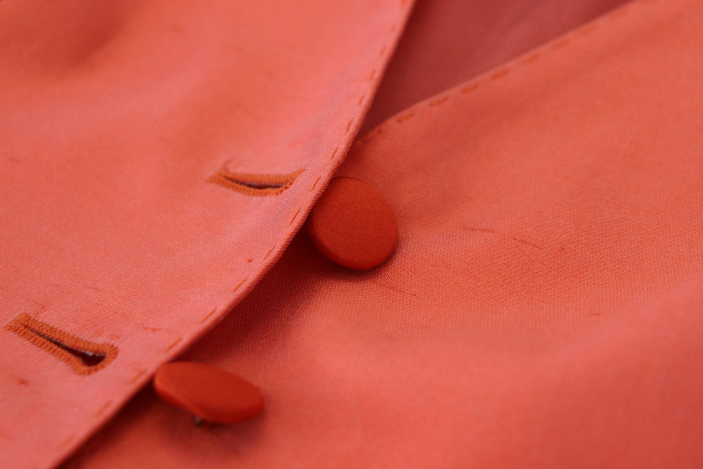 Gilet sans manches orange Dolce & Gabbana, coupe cropped, veste cintrée en tissu léger.