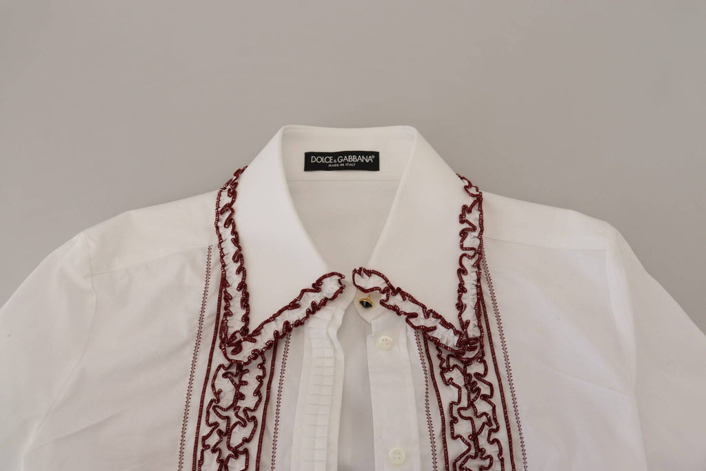 Chemise blanche en dentelle Dolce & Gabbana à manches longues et col à volants, élégante et raffinée.