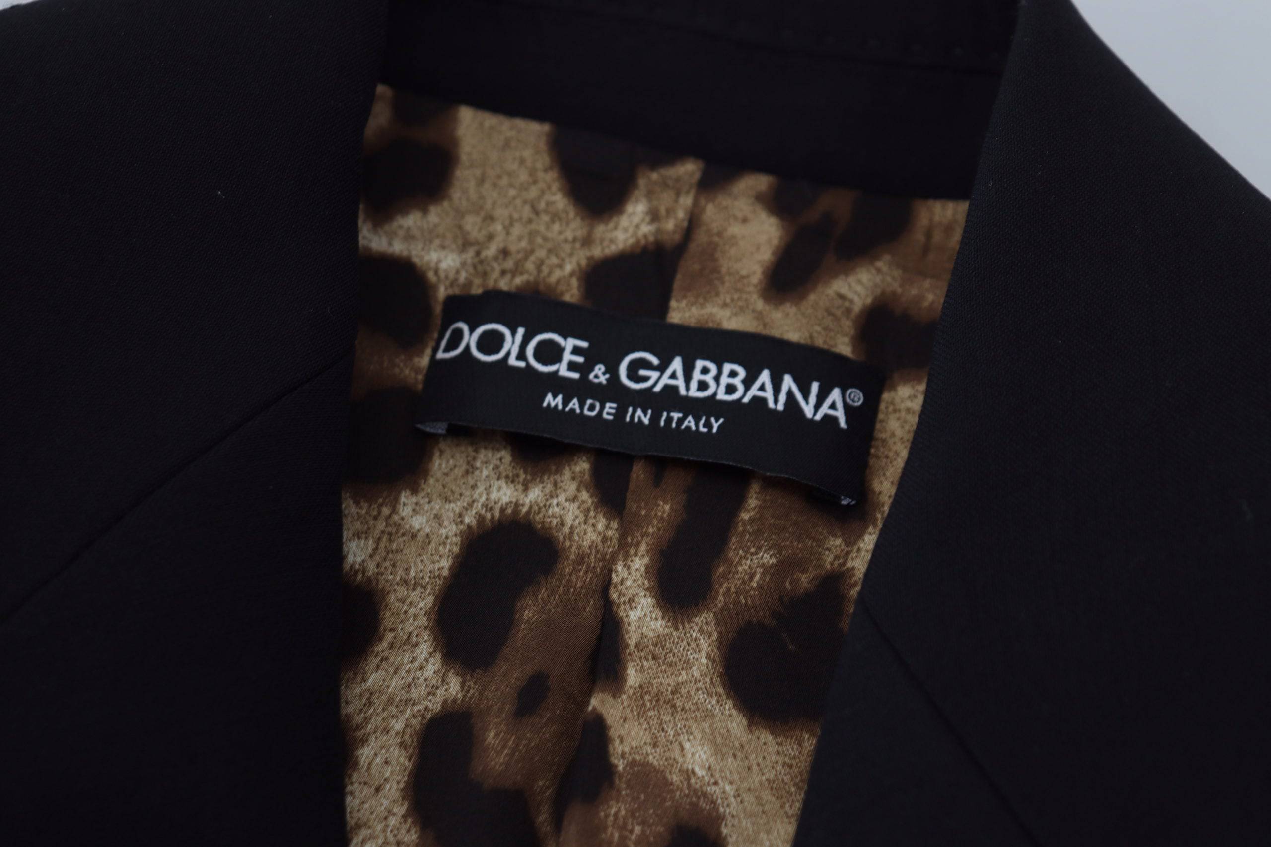 Veste blazer en laine noire à un seul bouton de Dolce & Gabbana, coupe ajustée, élégante et sophistiquée.
