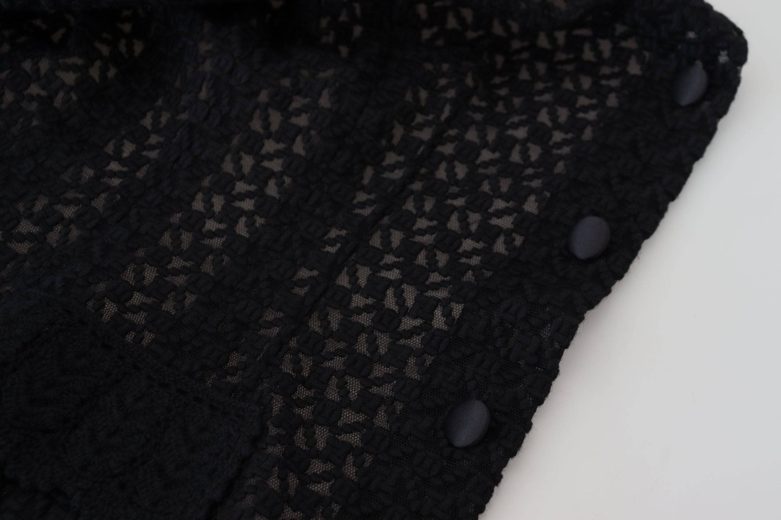 Veste en laine noire Dolce & Gabbana avec col boutonné et style tricoté, visible en détail.