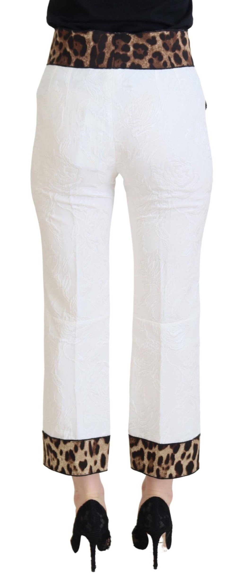 Pantalon blanc à taille haute Dolce & Gabbana avec imprimé léopard, tissu fluide et élégant pour un style sophistiqué.