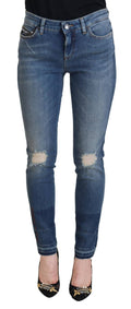 Jeans en denim déchiré en coton lavé bleu de Dolce & Gabbana, style décontracté et tendance.