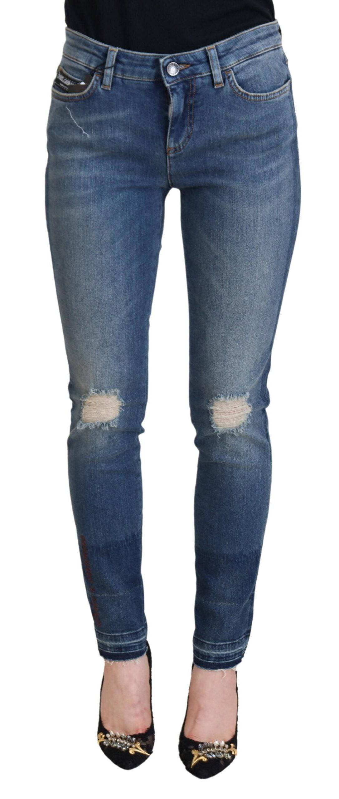 Jeans en denim déchiré en coton lavé bleu de Dolce & Gabbana, style décontracté et tendance.