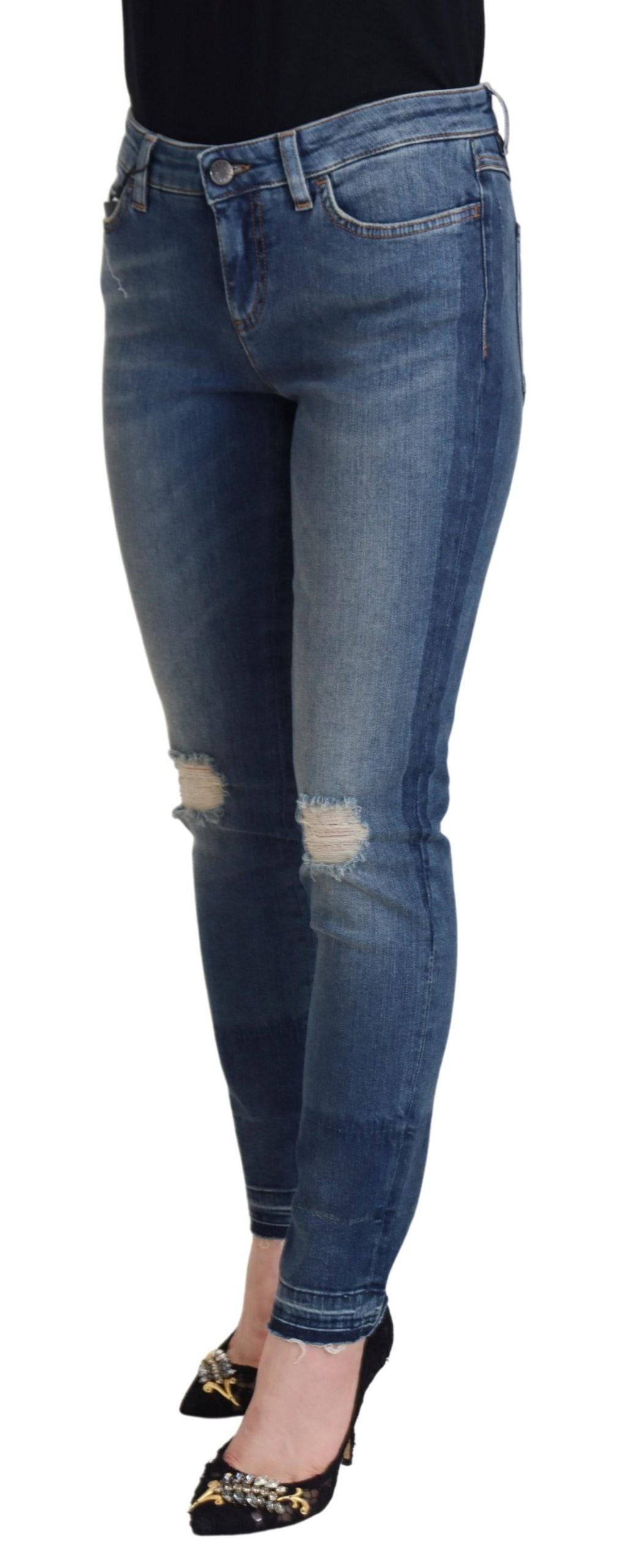 Jeans en denim délavé bleu Dolce & Gabbana, en coton usé avec des détails déchirés et un style décontracté.