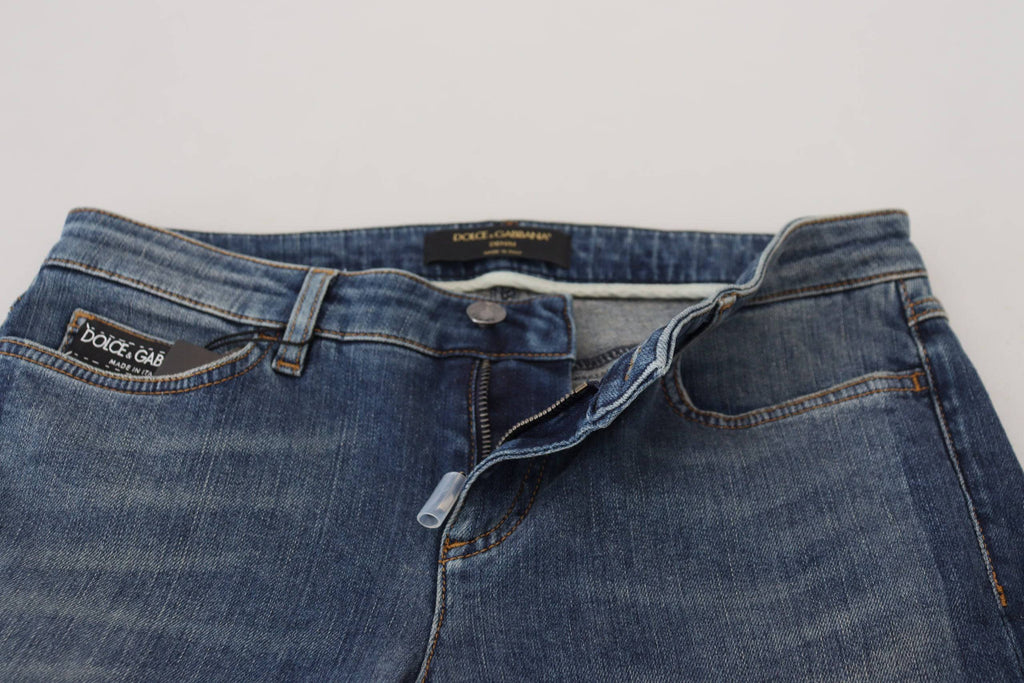 Jeans en denim délavé bleu Dolce & Gabbana avec déchirures et style usé, en coton.