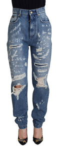 Jeans en denim déchiré en coton lavé bleu de Dolce & Gabbana, style décontracté et tendance.