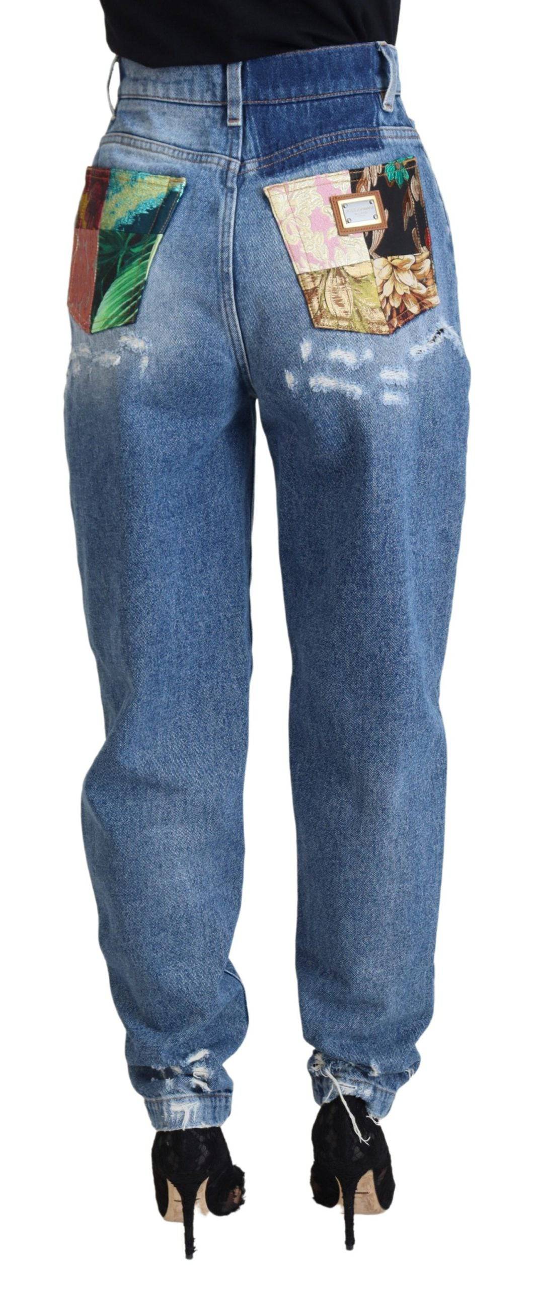 Jeans en denim délavé tacheté Dolce & Gabbana en coton bleu avec ourlets effilochés et style décontracté.