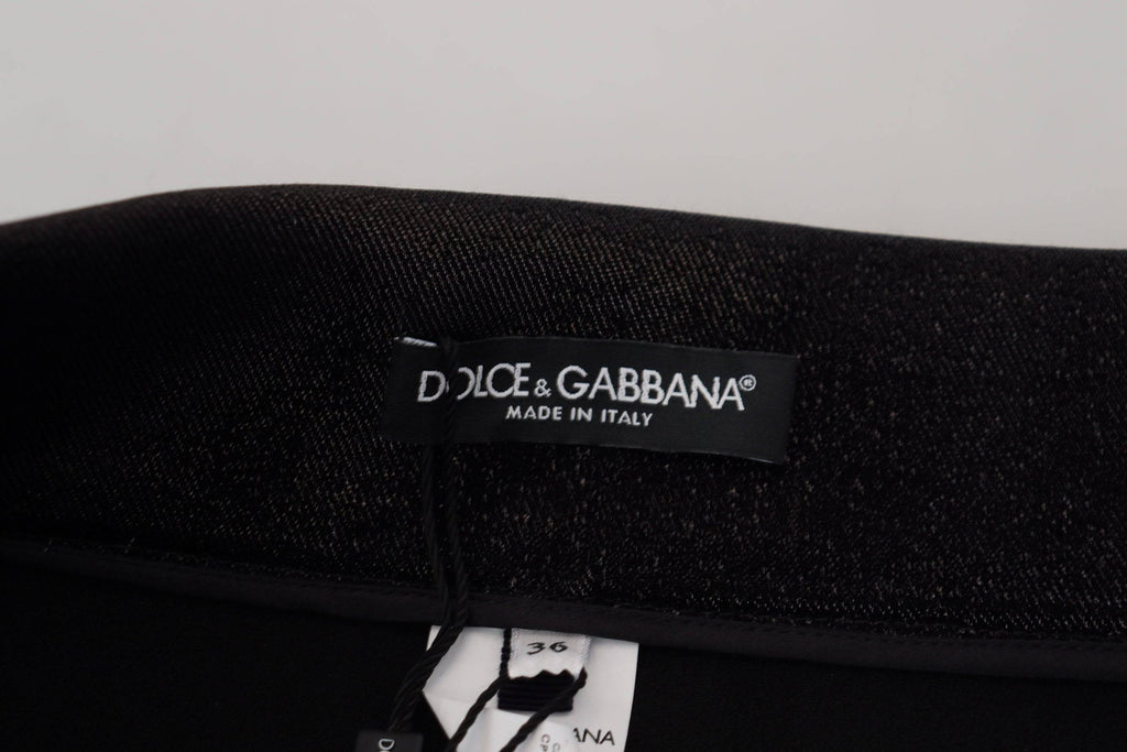 Jeans skinny en denim noir délavé de Dolce & Gabbana, en coton, visibles avec détails de style et coupe ajustée.
