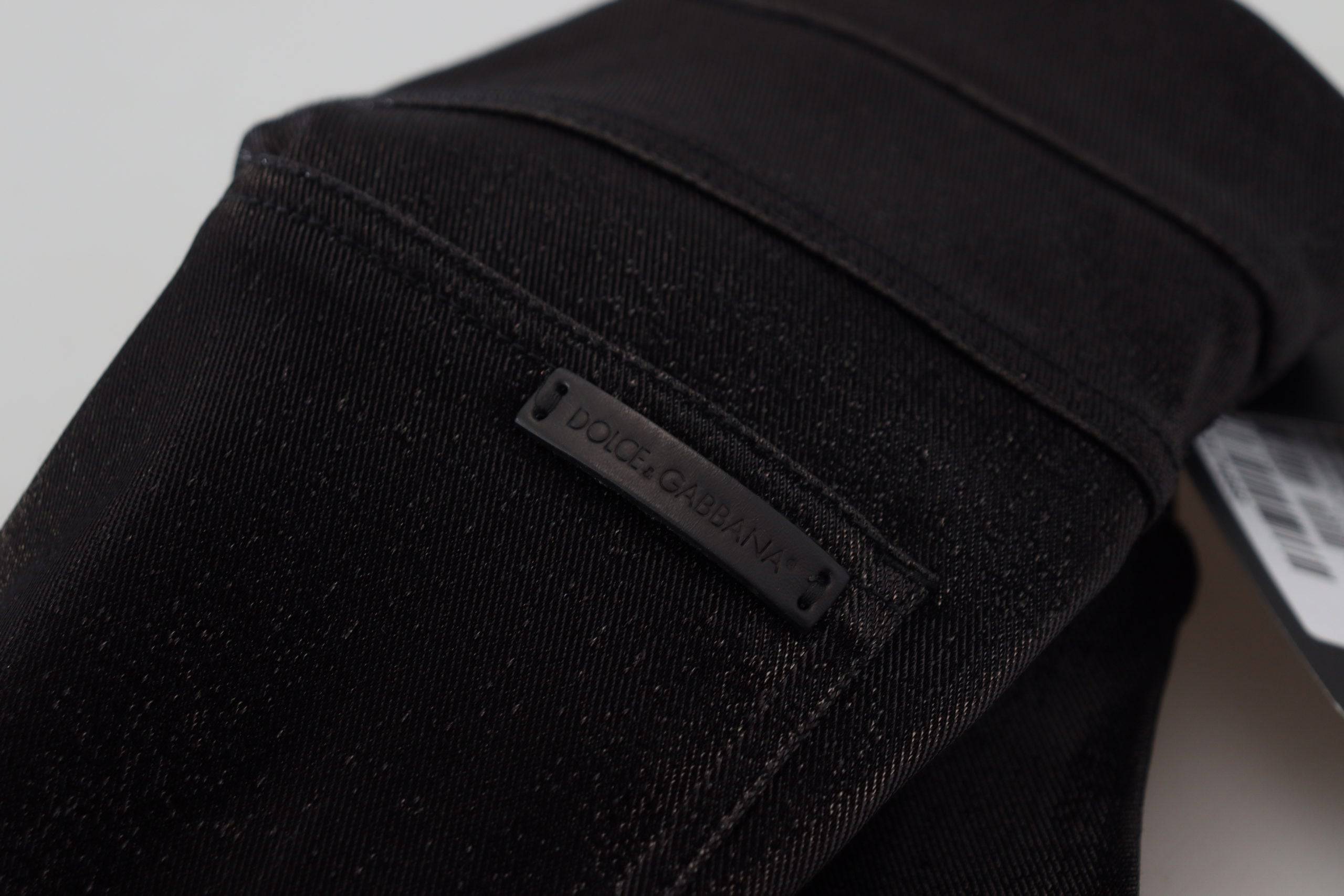 Jeans skinny en coton lavé noir de Dolce & Gabbana, coupe ajustée, détails modernes, vue de devant sur fond neutre.