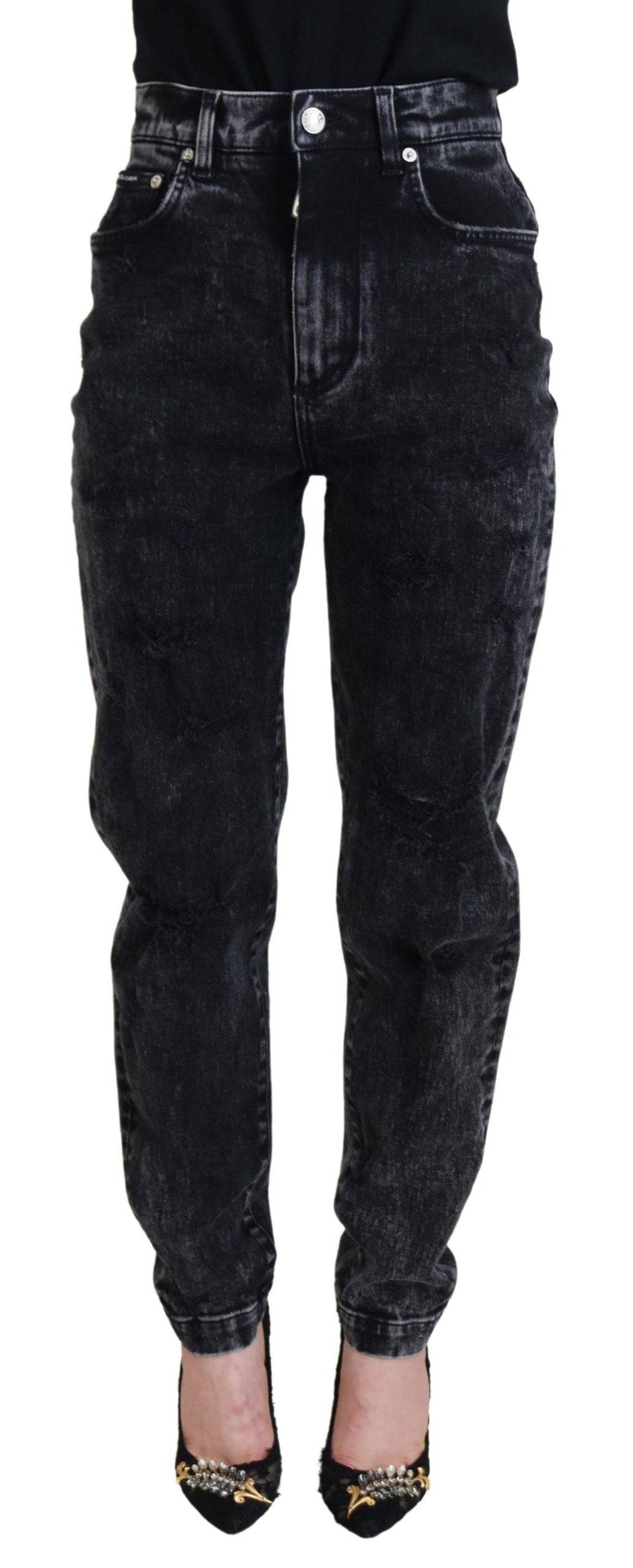 Jean en denim noir Dolce & Gabbana, coupe taille haute en coton lavé, visible avec détails de couture et poches à l’arrière.