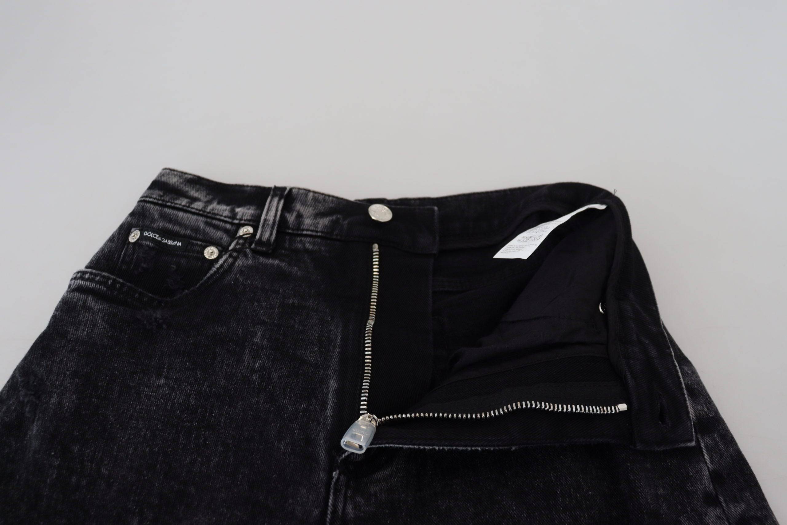 Jeans en denim noir délavé Dolce & Gabbana à taille haute, coupe tendance et détails en coton.