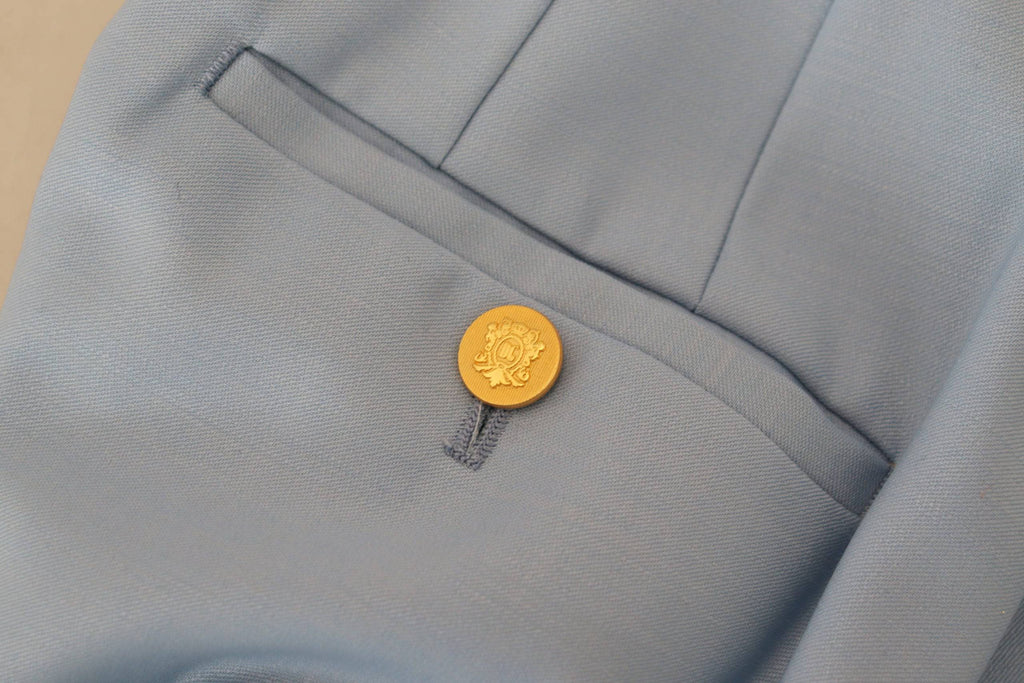 Pantalon large à boutons Light Blue de Dolce & Gabbana, coupe ample, tissu léger, style élégant et sophistiqué.