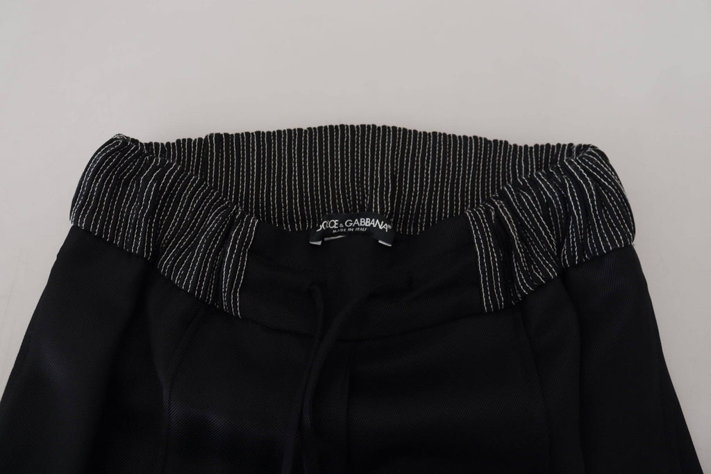 Pantalon droit en coton noir de Dolce & Gabbana, style élégant et classique, visible avec une coupe ajustée.