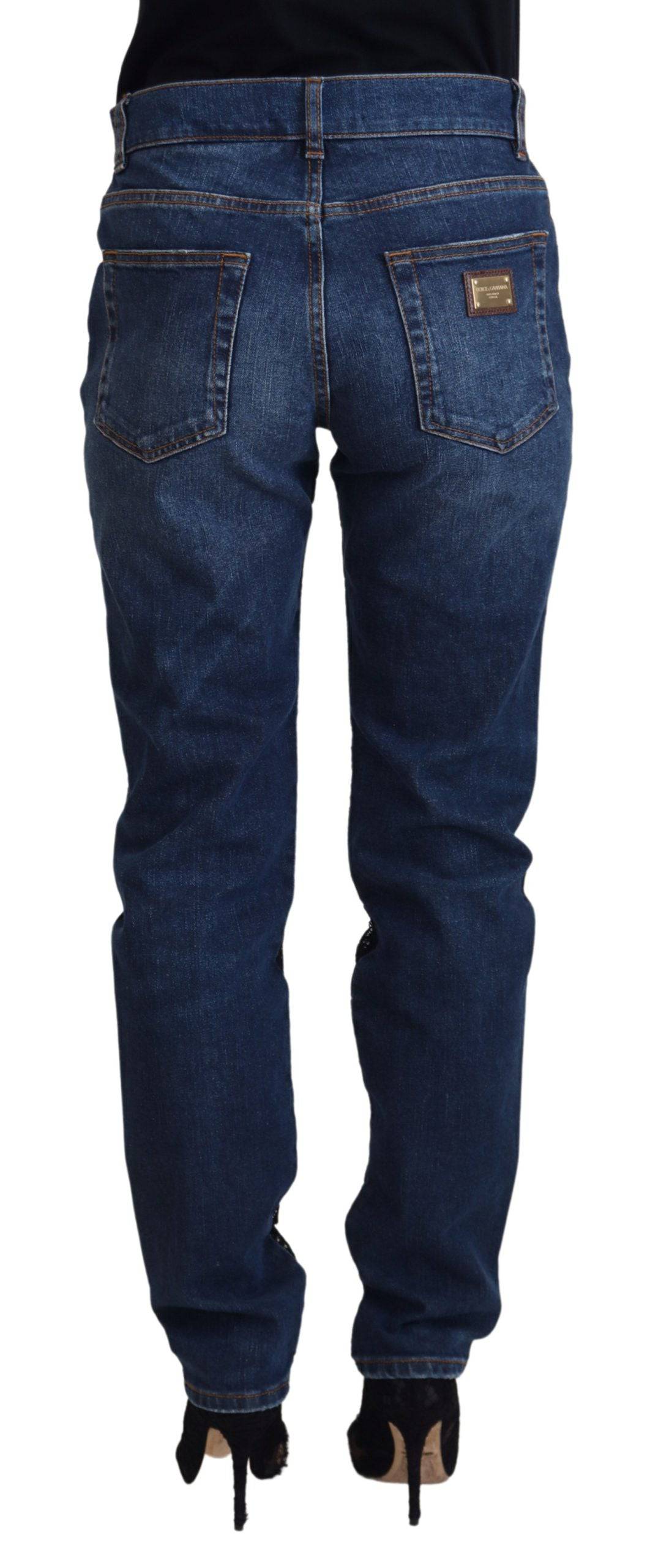 Jeans skinny en denim noir Dolce & Gabbana avec dentelle florale à l'avant, coupe ajustée et détails élégants.