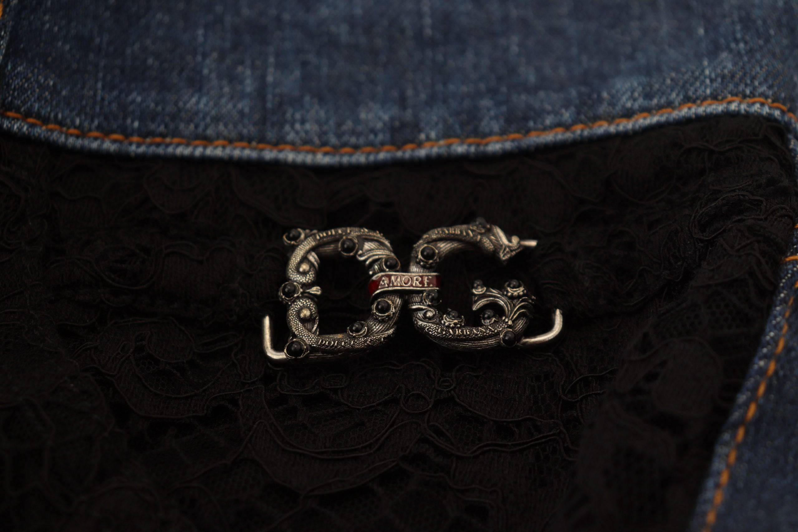 Jeans skinny en denim noir Dolce & Gabbana avec dentelle florale à l'avant, coupe ajustée et détails élégants.