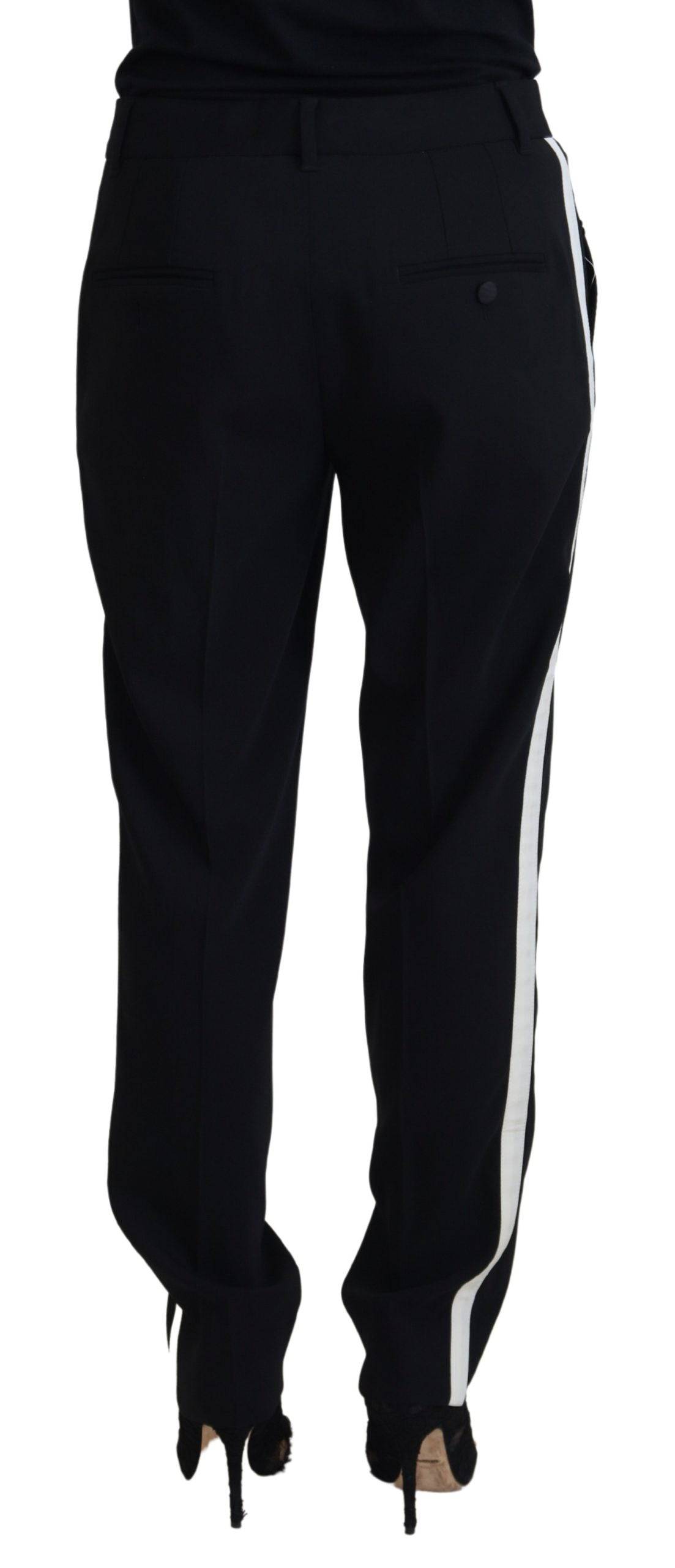 Pantalon en laine noire pour femmes de coupe tapered, de la marque Dolce & Gabbana, visible en détail dans l'image.